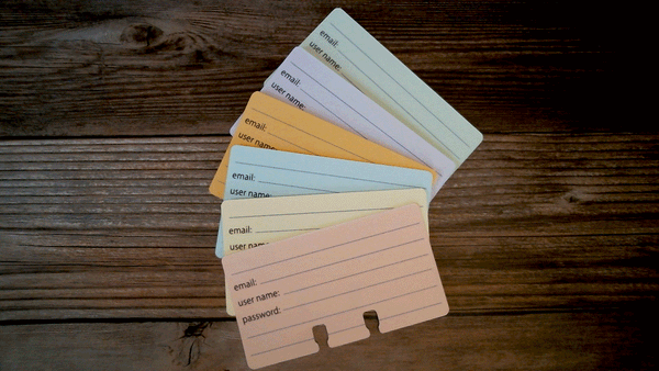 Password Rolodex cards in 6 pastel colors. They are arranged in a fan shape of pink, yellow, blue, orange, purple and green.
