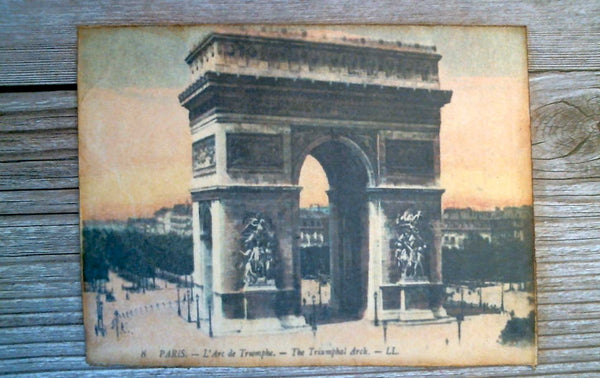 A vintage print of L'arc de Triomphe made into a post card.