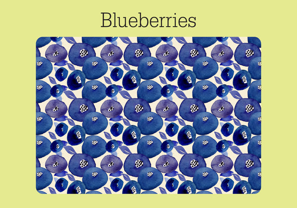 The cover of a colorful password log on a ring. The white background has a blue and purple watercolor pattern of blueberries. It is shown on a pale green background with the word "Blueberries."