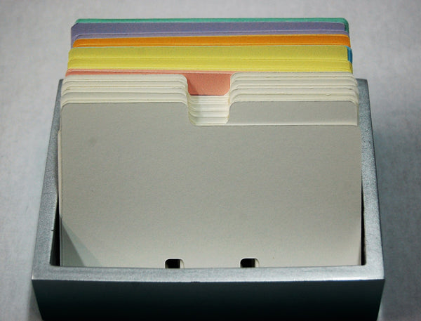 White rolodex Dividers in a holder with pretty colored Rolodex cards