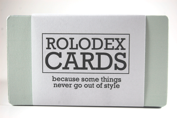 Mini rolodex cards in soft pastel colors. They are wrapped in a bundle of 28. The pastel green card is on top. The wrapper says "ROLODEX CARDS: because some things never go out of style."