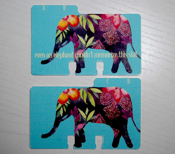 Two teal Rolodex dividers with a colorfully patterned elephant on them. The AB divider has "even an elephant couldn't memorize this shit" written on it. The CD divider does not.