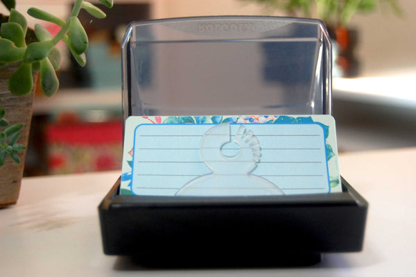 Printed Floral Rolodex Refill Cards. The cards are a pretty  succulent print in blue and mint green and pink. The lined cards are in a Rolodex holder with plants in the background.