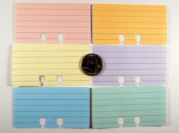 Mini Lined Rolodex Cards in 6 pastel colors: pink, orange, yellow, purple, blue, green. There is a quarter in the center to show size.