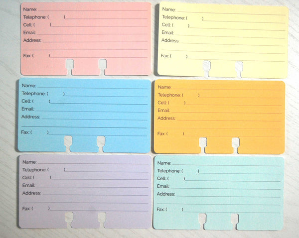 A flat lay overhead view of colorful pastel Rolodex Contact Cards in pink, yellow, blue, orange, purple, and green.
