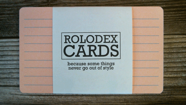 A pack of 3 x 5 ruled Rolodex cards in six colors. the pink Rolodex card is on top. The wrapper says "ROLODEX CARDS - because some things never go out of style".