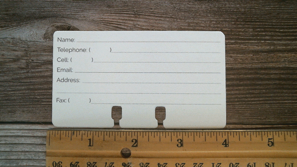 A white contact Rolodex card with a ruler showing the 4 inch size.  There  are lines to write Name, Telephone, Cell, Email, Address, and Fax.