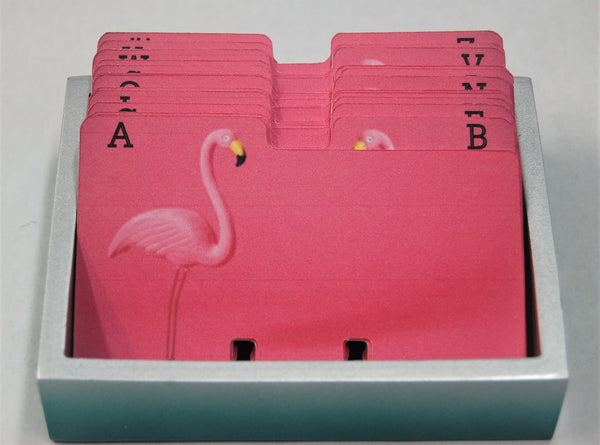 Bright pink Rolodex dividers with a flamingo and one letter per card in  a pretty holder