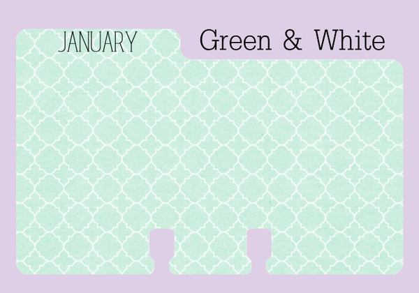 A Rolodex divider refill: This pretty divider is mint green with a white quatrefoil pattern. The tab has the world "JANUARY" in black capital letters. It is on a purple background with the words "Green and White".