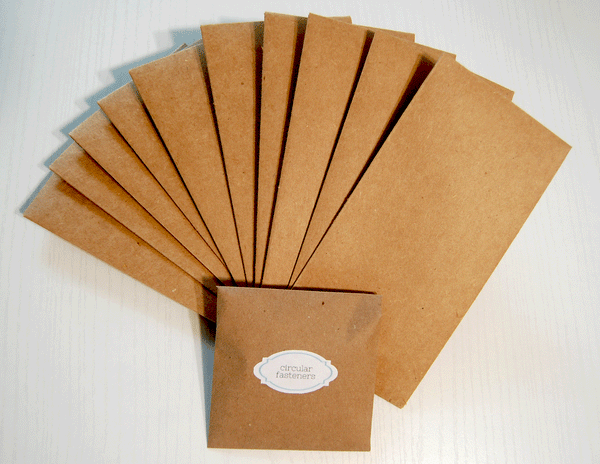 Kraft Cardstock Envelope with Twine Closure Kit: There are 10 kraft cardstock envelope bases and a matching envelope that has a label on it that says " circular fasteners."