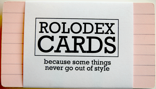 A pack of 30 lined Rolodex cards in 6 colors - pink on top - with a white wrapper with black writing that says, "ROLODEX CARDS - because some things never go out of style."