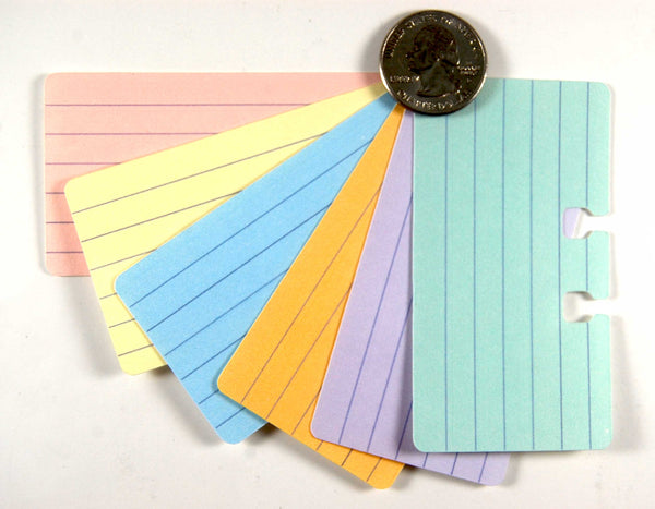Tiny Lined Rolodex Cards in 6 pastel colors: pink, yellow, blue, orange, purple green. They are arranged in a fan and have a quarter for size comparison.