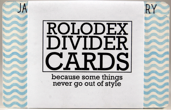 Colored Rolodex Monthly Dividers: These sturdy dividers are white with a medium blue wave pattern. They are wrapped in a bundle of 13 (all the months and a blank). The label is white with black writing and says, "ROLODEX DIVIDER CARDS because some things never go out of style."