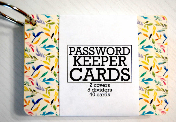 Password Keeper Cards on a ring. The cover is beige with a floral watercolor garden print. The wrapper shows that it contains 2 covers, 5 dividers and 40 cards.
